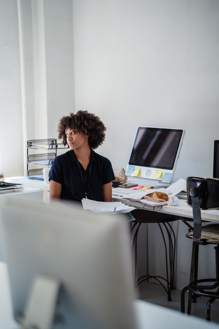 overworked woman in office